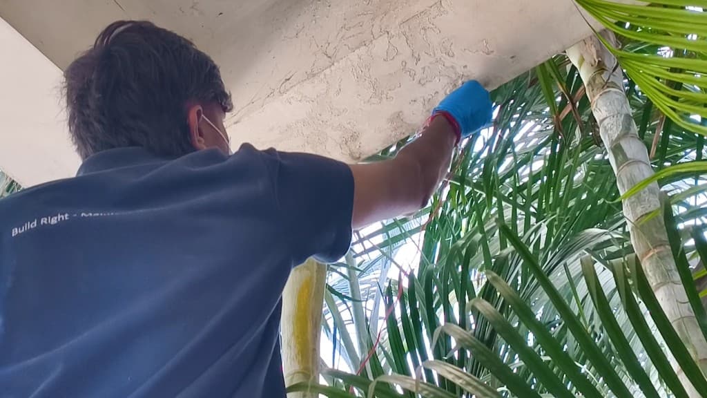 Cyond technician inspecting structural crack during virtual-assisted leak assessment Hyderabad